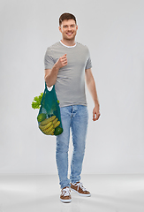 Image showing happy man with food in reusable net tote