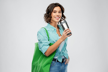 Image showing woman with bag for food shopping and tumbler