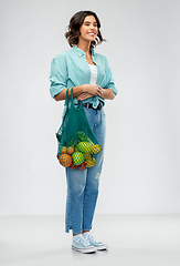 Image showing happy smiling woman with food in reusable net bag