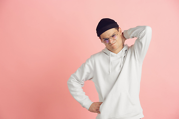 Image showing Caucasian young man\'s modern portrait on pink studio background