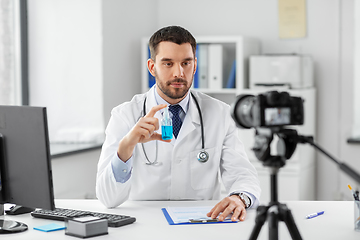 Image showing doctor with hand sanitizer recording video blog