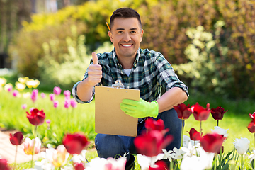 Image showing man with clipboard showing thumbs up garden