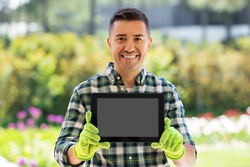 Image showing happy man with tablet pc at summer garden