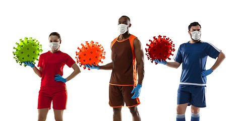 Image showing Basketball and football players kicking, punching coronavirus, protection and treatment concept, flyer