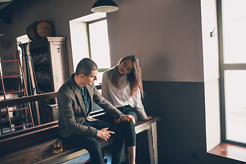 Image showing Cheerful man and woman talking, enjoying, having fun at bar, cafe