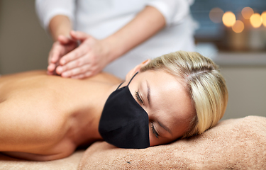 Image showing close up of woman lying and having massage in spa