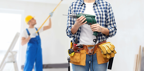 Image showing woman or builder with drill and work tools