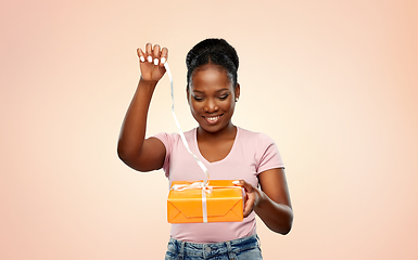 Image showing happy african american woman with gift box