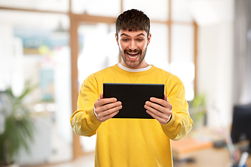 Image showing smiling young man with tablet pc computer