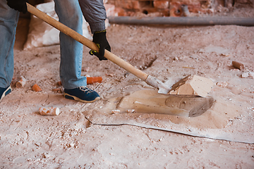 Image showing Close up of hand of repairman, professional builder working indoors, repairing