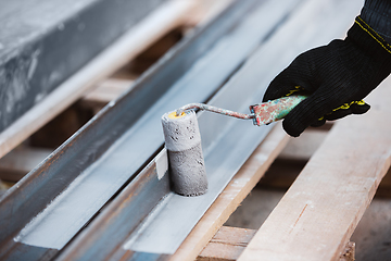 Image showing Close up of hand of repairman, professional builder working indoors, repairing