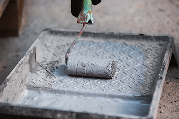 Image showing Close up of hand of repairman, professional builder working indoors, repairing