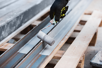 Image showing Close up of hand of repairman, professional builder working indoors, repairing