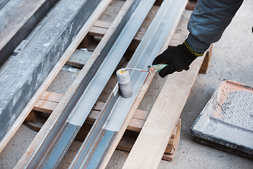 Image showing Close up of hand of repairman, professional builder working indoors, repairing