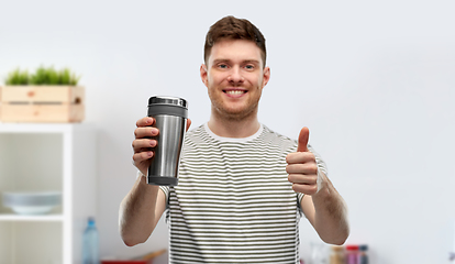 Image showing man with thermo cup or tumbler for hot drinks