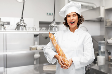 Image showing happy female chef with french bread or baguette