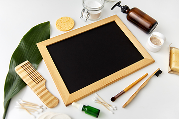 Image showing natural cosmetics and chalkboard