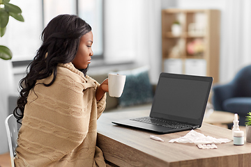 Image showing sick woman with tea having video call on laptop