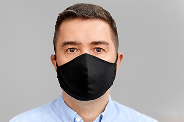 Image showing middle-aged man in reusable face protective mask