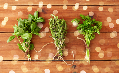 Image showing greens, spices or medicinal herbs on wooden boards