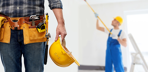 Image showing worker or builder with helmet and working tools