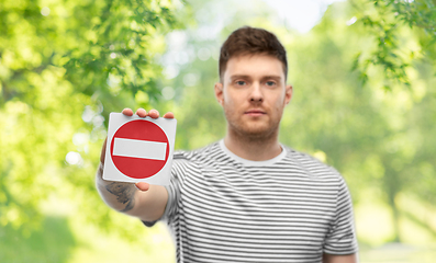 Image showing young man showing stop sign