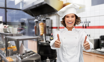 Image showing happy female chef showing thumbs up at kebab shop