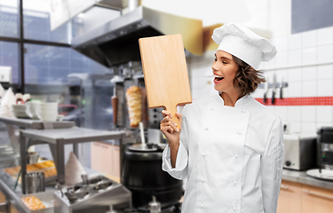 Image showing happy female chef with cutting board at kebab shop