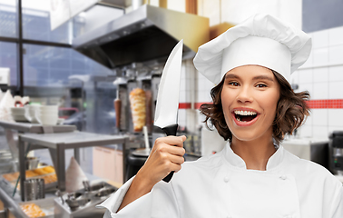 Image showing female chef with kitchen knife at kebab shop