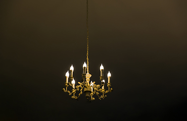 Image showing ceiling lamp or chandelier hanging in dark room