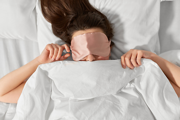 Image showing woman with eye sleeping mask in bed under blanket