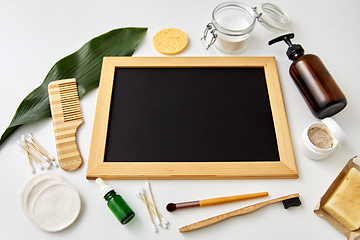 Image showing natural cosmetics and chalkboard