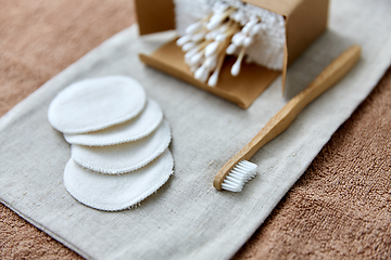 Image showing wooden toothbrush, cotton pads and swabs in box