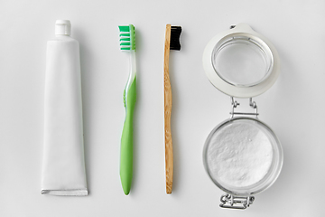 Image showing toothbrushes, toothpaste and soda in jar