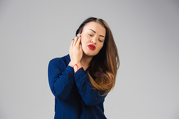 Image showing Young woman suffers from pain, feels sick, ill and weakness isolted on studio background