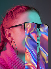 Image showing Modern woman\'s portrait on studio background in bright neon light, stylish creative design