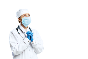 Image showing Female young doctor with stethoscope and face mask isolated on white studio background