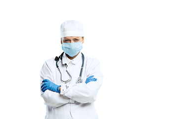 Image showing Female young doctor with stethoscope and face mask isolated on white studio background