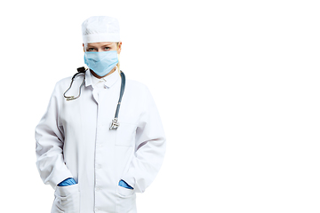 Image showing Female young doctor with stethoscope and face mask isolated on white studio background