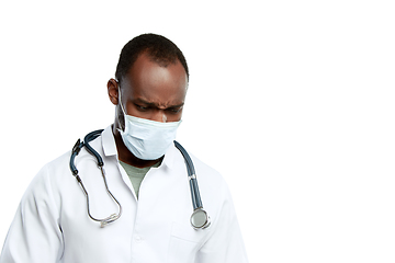 Image showing Male young doctor with stethoscope and face mask isolated on white studio background