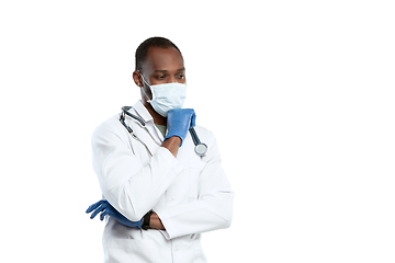 Image showing Male young doctor with stethoscope and face mask isolated on white studio background