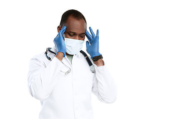 Image showing Male young doctor with stethoscope and face mask isolated on white studio background