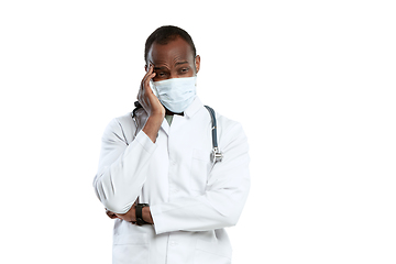 Image showing Male young doctor with stethoscope and face mask isolated on white studio background