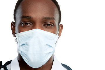 Image showing Close up young doctor with stethoscope and face mask isolated on white studio background