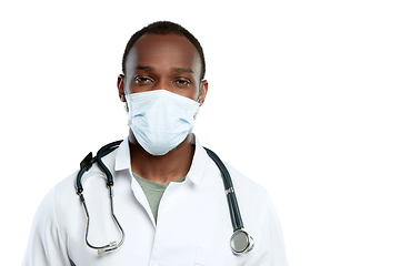 Image showing Male young doctor with stethoscope and face mask isolated on white studio background