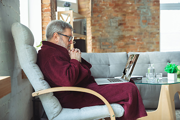 Image showing Mature senior older man during quarantine, realizing how important stay at home during virus outbreak