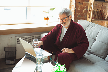 Image showing Mature senior older man during quarantine, realizing how important stay at home during virus outbreak