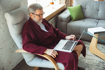 Image showing Mature senior older man during quarantine, realizing how important stay at home during virus outbreak