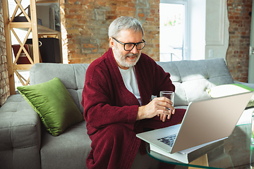 Image showing Mature senior older man during quarantine, realizing how important stay at home during virus outbreak