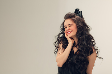 Image showing Portrait of beautiful young woman isolated on grey studio background